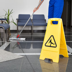 Man Cleaning The Floor